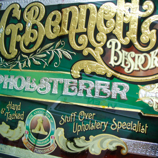 G. Bennett Upholsterer. Glass Sign